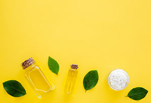 Bottle of Manuka oil with leaves